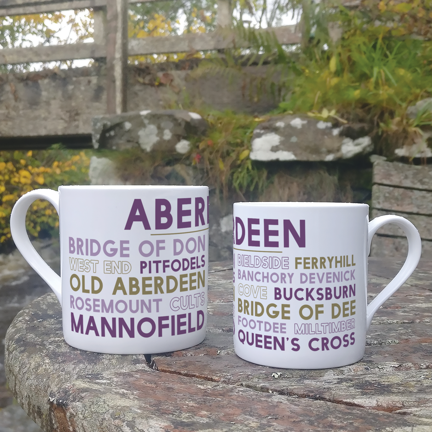 Two Aberdeen china mugs on an outdoor table, a larger 13oz size and a smaller 8oz size