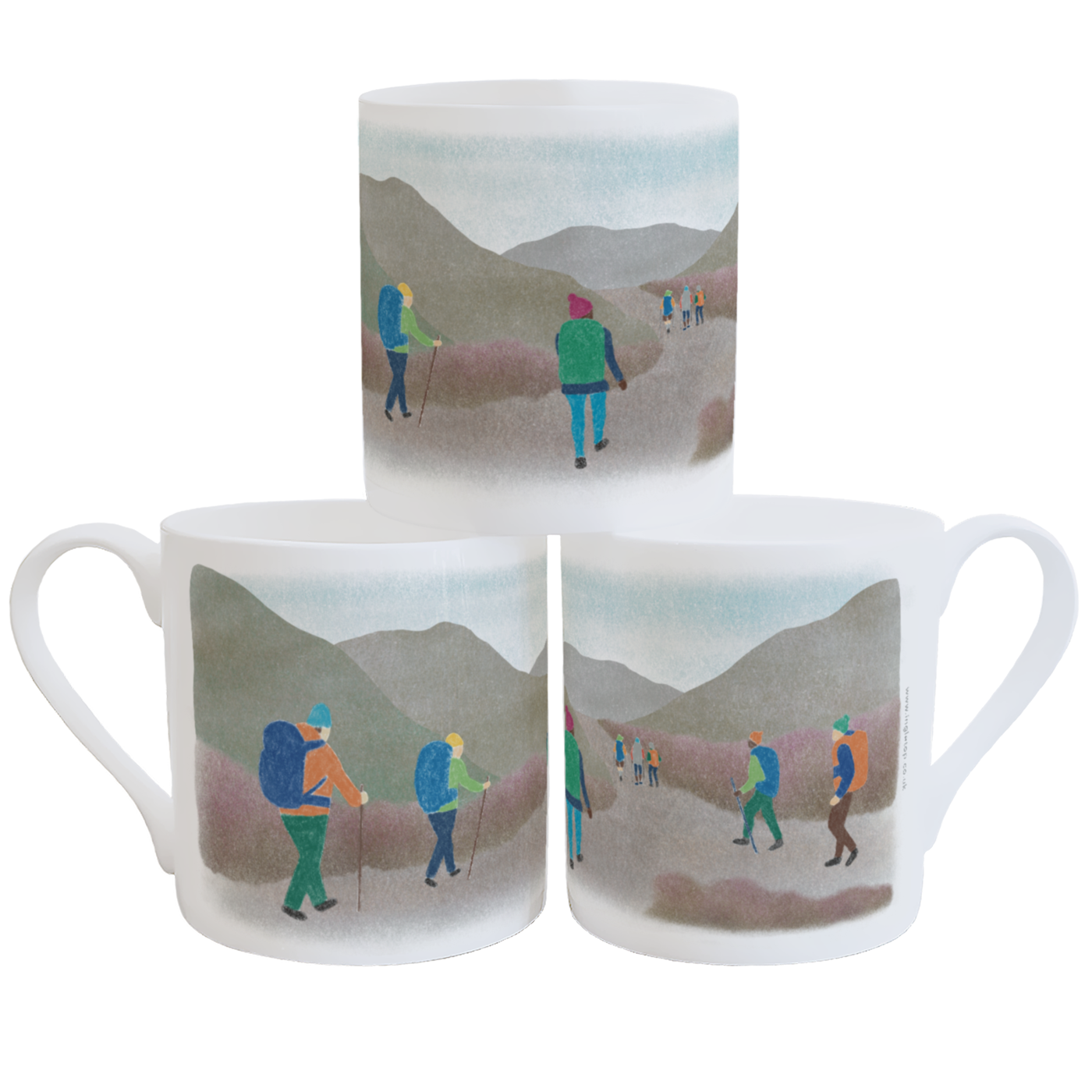 A stack of three fine china mugs on a white background, decorated with a colourful illustration of hikers heading in to a hilly landscape