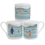 A stack of three fine bone china mugs on a white background, decorated with a wraparound illustration of eight people wild swimming outdoors 